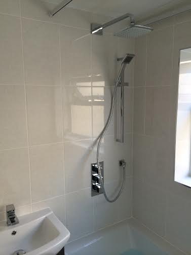 Classic white bathroom with huge square head shower